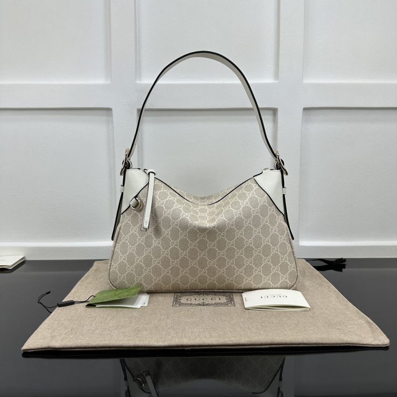 G*u*i top handle bags
